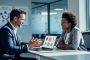 HR manager and employee in a modern office discussing workplace wellness and responsible online gambling support.